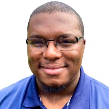 Image of a man in a blue shirt with glasses